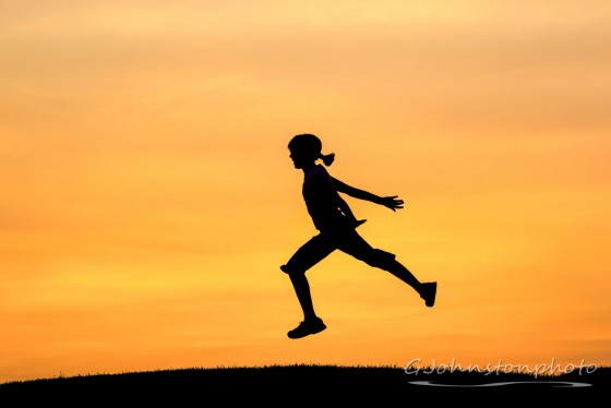 Leaping in the air.