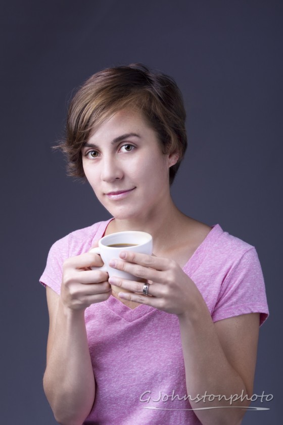 Woman enjoys cup of coffee.