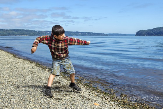 Throwing a rock into the water.