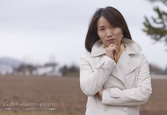 Asian woman on a cloudy day.