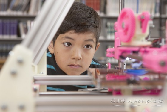 Watching the 3D printer.