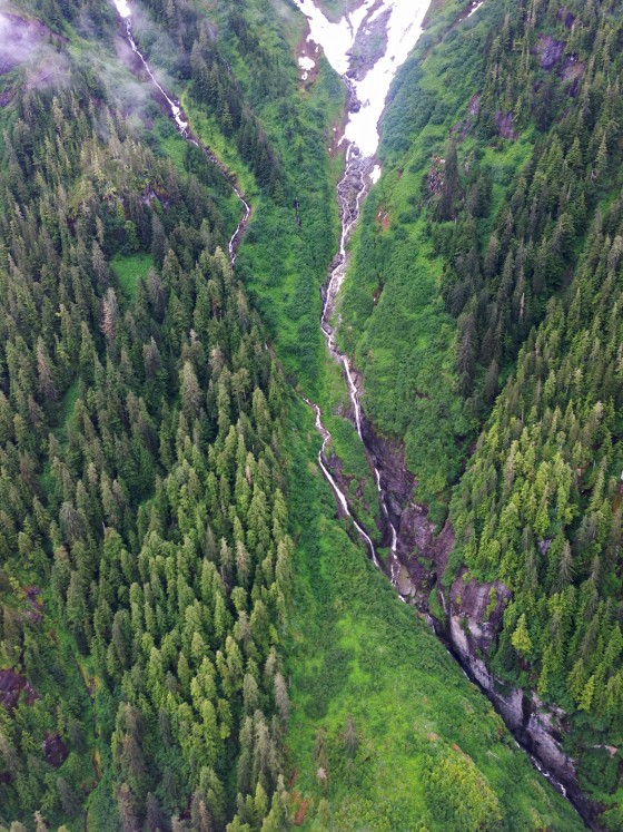 Alaska waterfalls, granite cliffs & pine trees
