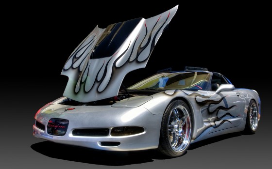 Heavily modified Corvette on a digital gradient background