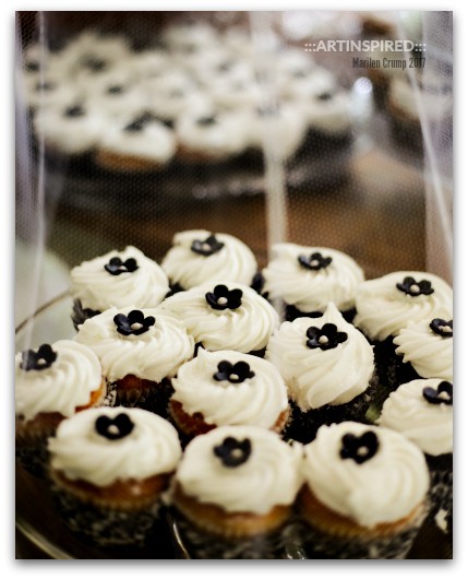 Chocolate Cupcakes topped with White Icing and Flower