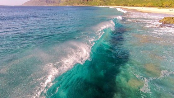 Waves breaking from a creative angle using drone.