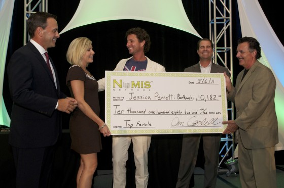 Receiving a giant check at an annual conference.