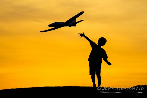 Tossing a toy airplane.