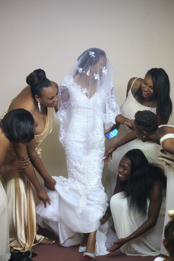 Bride maids help bride