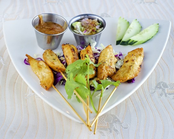 Skewered on a triangular plate.