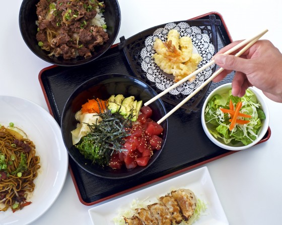 Handling chopsticks for an Asian lunch.