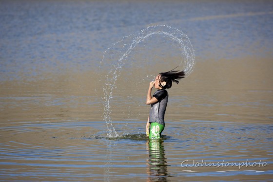 Arc of water from the girl.